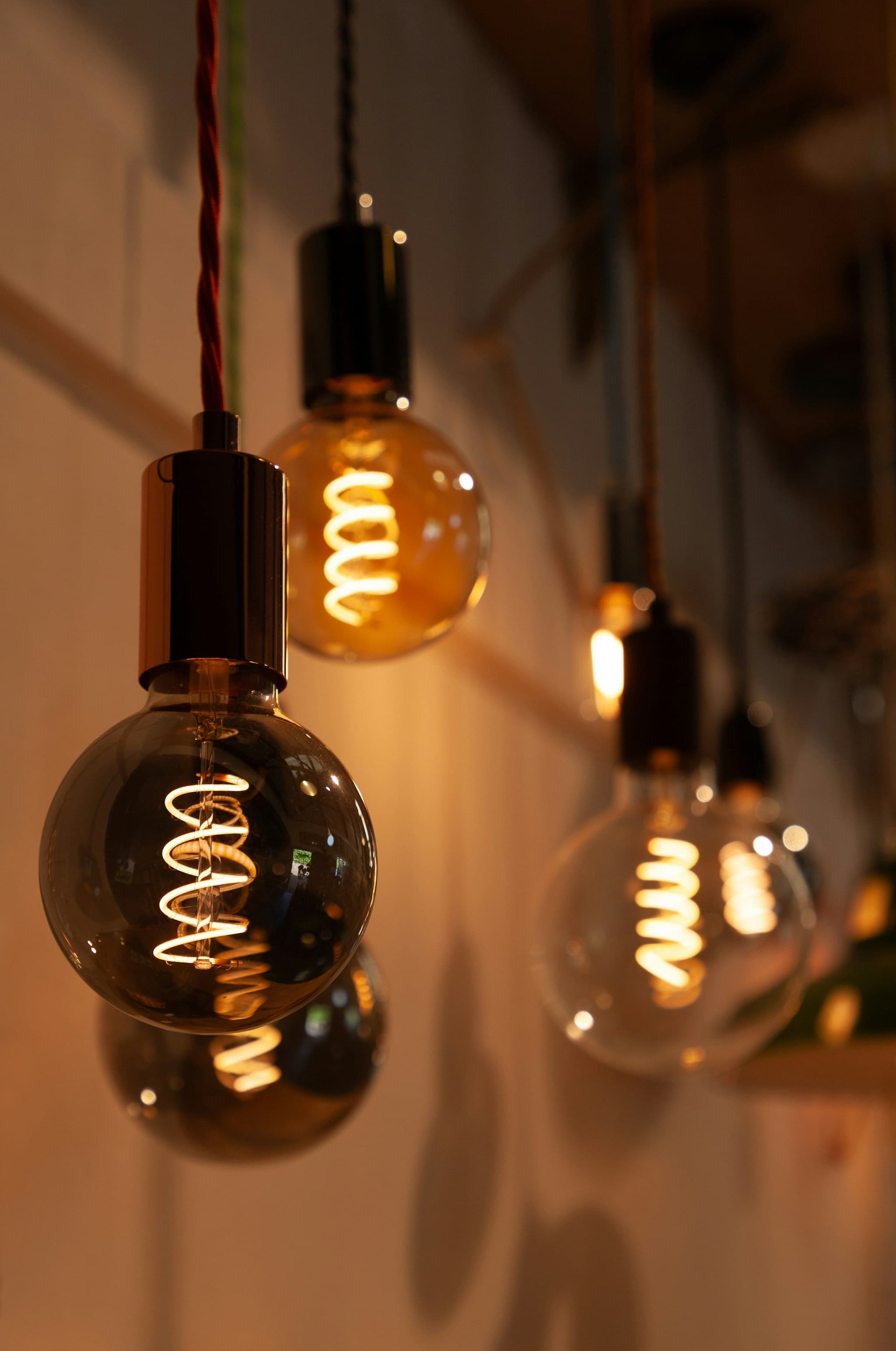 Group of light bulbs hanging from a ceiling
